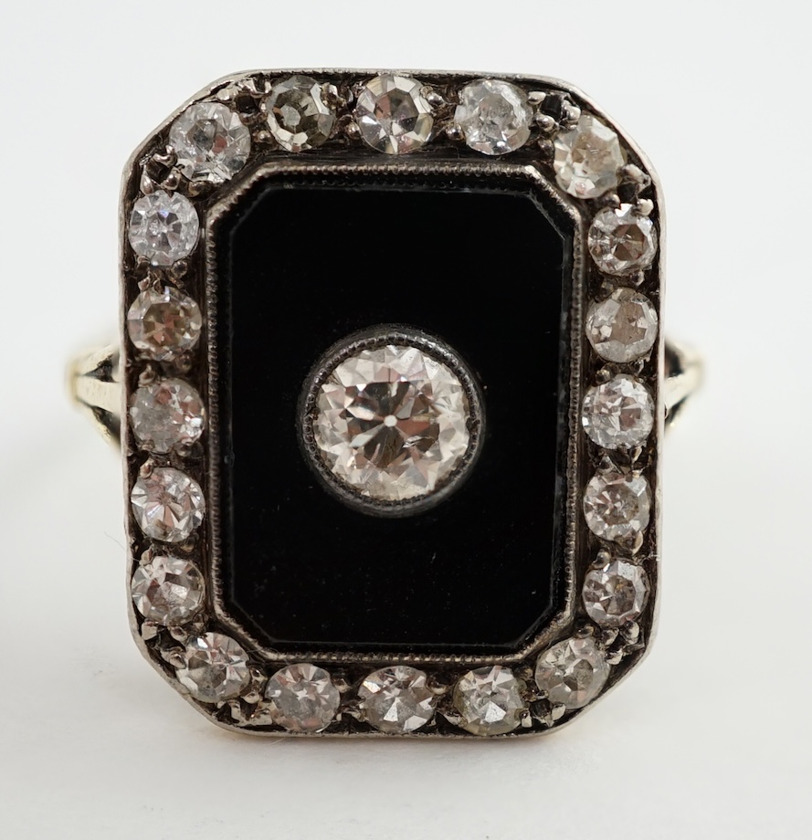 A 1940's? gold, black onyx and diamond cluster set tablet ring